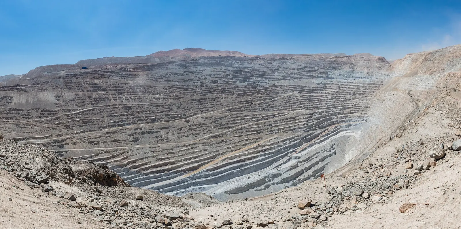 A vast terraced open-pit mine in a desert