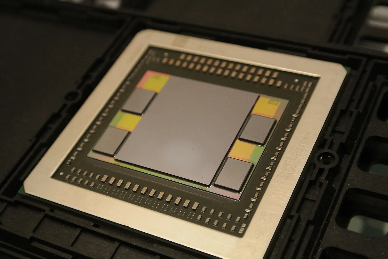 A GPU package with one large die surrounded by four smaller memory stacks