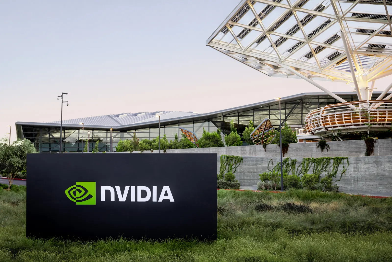 An NVIDIA sign in front of its triangular-roofed headquarters building