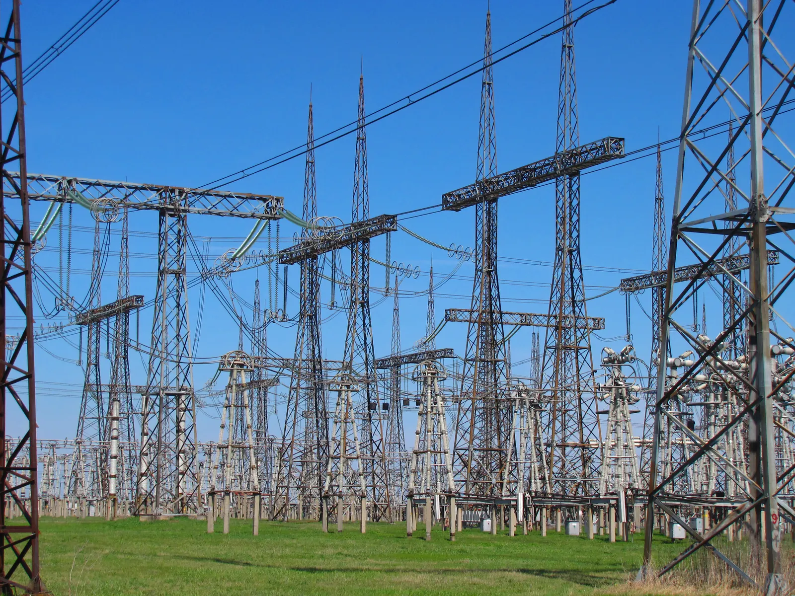 A switchyard full of steel towers and high-voltage equipment