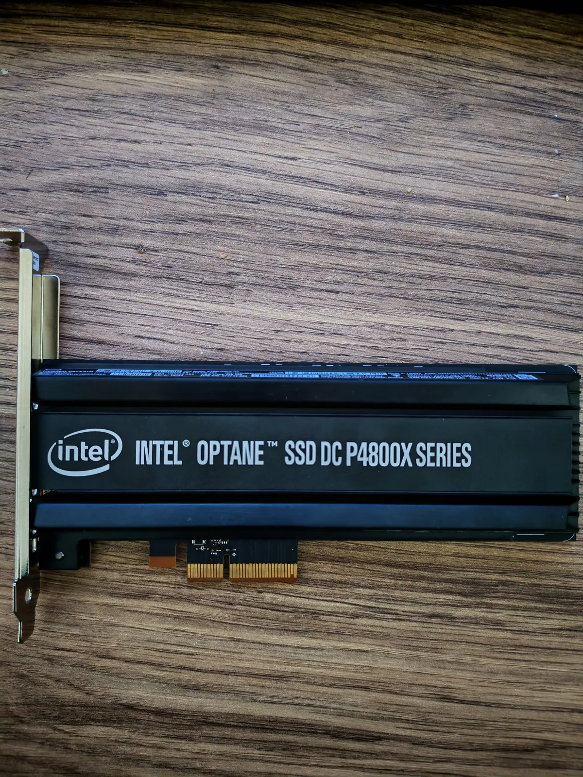 A dark blue PCIe card labelled Intel Optane SSD DC P4800X series